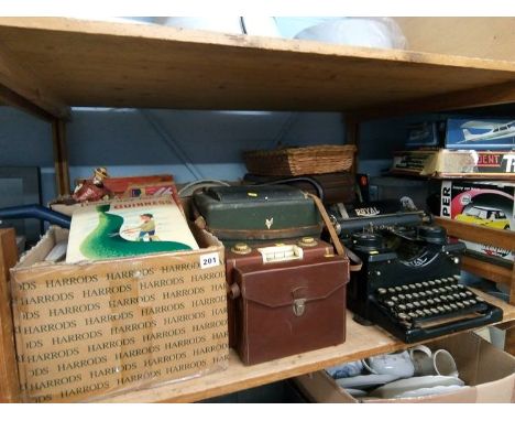 A shelf of assorted, including 'Royal' typewriter, 'Admica 8' cine camera etc.