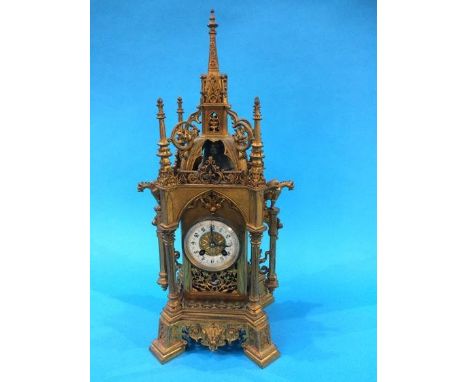 A 19th century gilt metal bracket clock of Gothic form, with eight day movement, enamelled dial, with strike action, 46cm hei