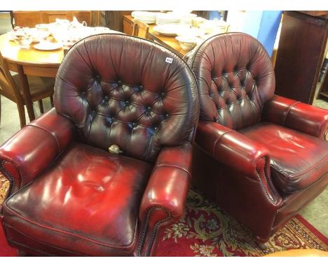 Pair of leather button armchairs