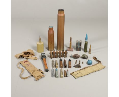 A 1947 3-IN-50 CAL Mk 7 shell case, 58cm, 11cm, a similar smaller shell case 34cm, a reproduction German S-Mine, similar stic