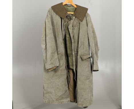 An American overcoat with green blanket lining and additional removable wool lining, with five button front and two deep pock