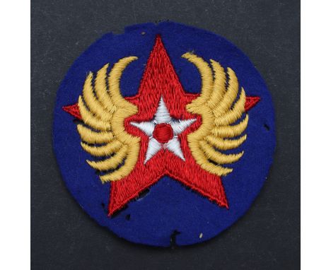 A Second World War U.S. Air Force Russian ferry command to the Soviet Union shoulder patch with a winged star against a blue 