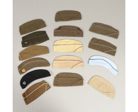 A collection of American military caps to include a cap by Funk Bros dated 1941, others with United States Navy badges, a num