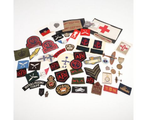 A mixed collection of Second World War and later patches and badges to include a National Hospital Reserve arm band, similar 