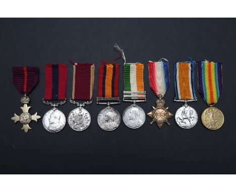 A group of eight comprising an OBE on first type military ribbon, unnamed as issued, an Edward VII Distinguished Conduct Meda
