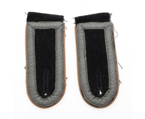 A pair of Waffen SS NCO's shoulder straps, black felt top with fieldgrey to the bottom, with pale brown piping and light grey