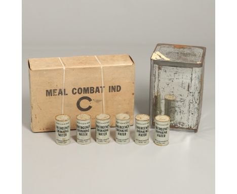 A collection of supplies to include an unopened box of 'C' rations 'Meal Combat Ind', Crown Zellerbach Corps. A large tin of 