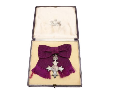 An MBE on first type civilian ribbon, hallmarked for London 1918, Garrard and Co.Ltd, in fitted Garrard and Co. case of issue