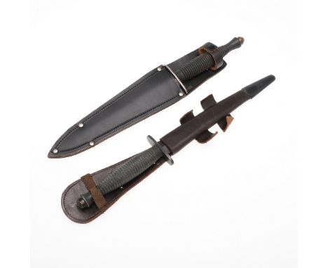 With a 17cm pointed double sided blade, straight cross-piece and ringed grip, unmarked, in a leather scabbard, 33cm overall, 