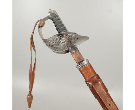 An 1897 Pattern Infantry Officers sword with an 83cm pointed unsharpened blade with deep fuller, with a three-quarter basket 