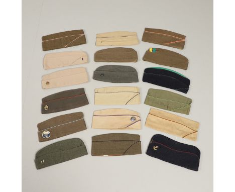 A collection of American military caps to include a cap by Bernard, style 1960 with United States Navy badge, a number in sha
