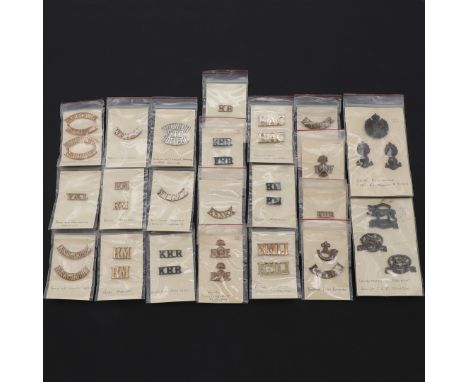 An extensive collection of Shoulder Titles to include: Durham Light Infantry, Royal Ulster Rifles, Parachute regiment, Inns o