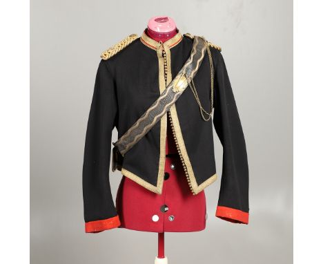 The black short shell jacket with gilt braided borders and seeded buttons, with scarlet lining and label for J.B. Johnstone D