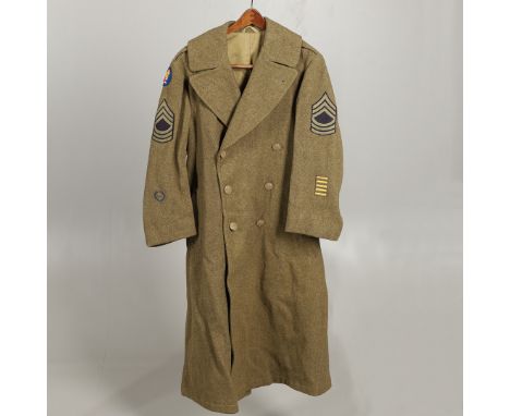 An American soldier's uniform great coat with pressed 'Great Seal' buttons, rank of Master Sergeant, five overseas service ba