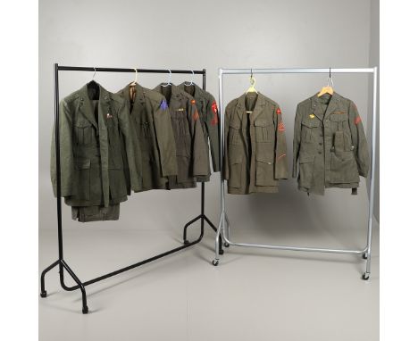 A collection of US Marine Corps uniform: A four pocket dress jacket with rank of Sergeant and IIIrd Air Wing Division shoulde