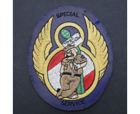 A large oval patch with an American soldier in front of the number '8' with wings and 's pecial Service', 15 x 12.5cm. *CR ve