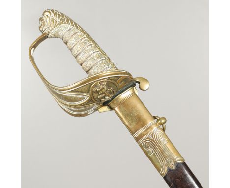 With a 79cm pointed and sharpened blade decorated with a Royal crest and fouled anchor, with brass guard with further fouled 