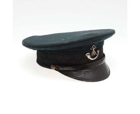 A black 1908 pattern peaked cap with decorative cap band with scrolling oak leaves and acorns, and an Oxfordshire and Bucking