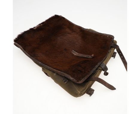 A German army or Waffen-SS soldier's backpack with fur covered back, leather straps and fittings, stamped 'Jean Weipern Offen
