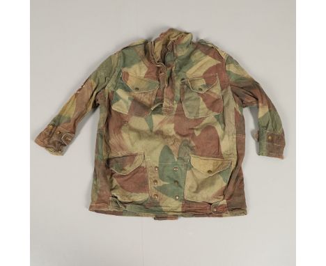A SECOND WORLD WAR PERIOD DENNISON SMOCK. A Dennison half zip smock with four pocket front and button cuffs. With internal la
