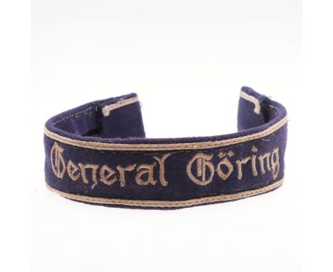 A Luftwaffe 'General Goring' cuffband, machine woven in very light grey cotton on dark blue felt with light grey borders abov