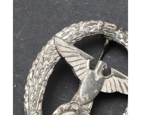 An unusual 'Gau Baden' badge with an eagle with wings outstretched above a swastika and Gau Baden, within a wreath, with vert