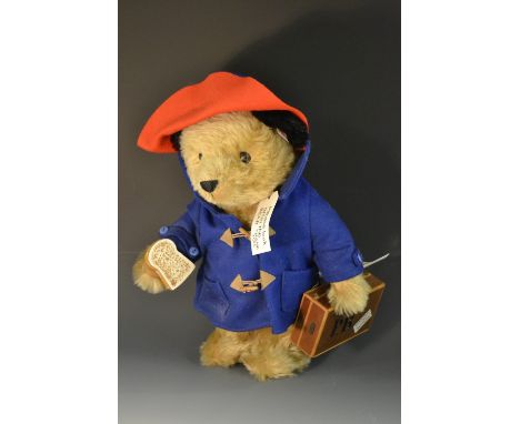 A Steiff Paddington Bear, 2003, mohair, red hat, blue coat, PB suitcase, white tag 354250, LE 5000, original tag No 00807, 32