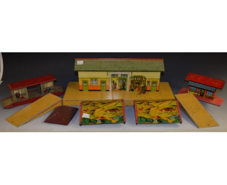 A Hornby Meccano Railway Station, lithograph printed in colours with Station Master's door, Waiting Room and Bookstall, 42cm 