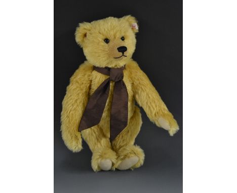 A Steiff golden mohair growling Teddy Bear, slight hunchback, long arms, with tilt action growler, 38cm high, white ear tag