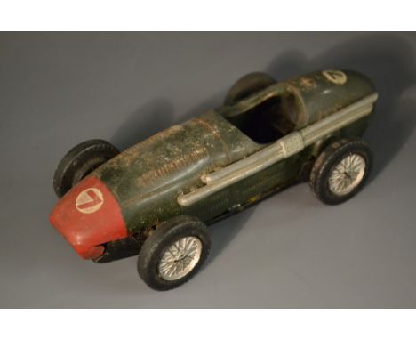 Scalextric - an early tinplate Racing Car,  dark green, racing number 7, red front, lacking steering wheel and driver but inc