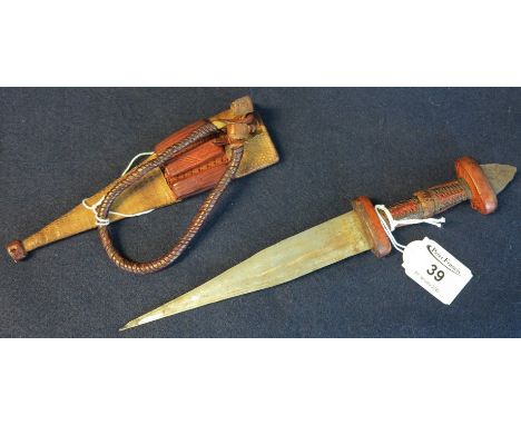 Small African dagger with leather hilt having reverse blade and snakeskin covered scabbard. (B.P. 24% incl. VAT)