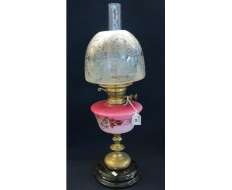 Early 20th Century brass double burner oil lamp with ceramic reservoir, brass pedestal and ceramic base, etched glass shade a