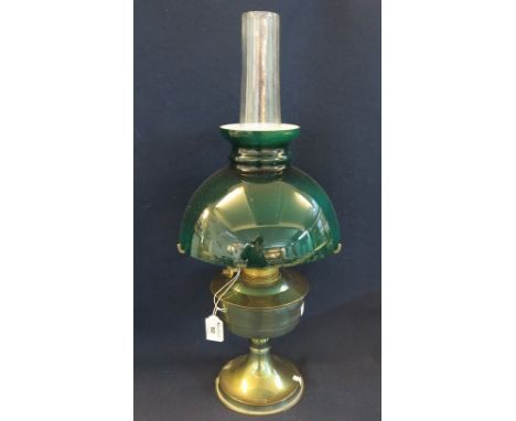 20th Century plated metal oil lamp with coloured overlay glass shade and clear chimney. (B.P. 24% incl. VAT)