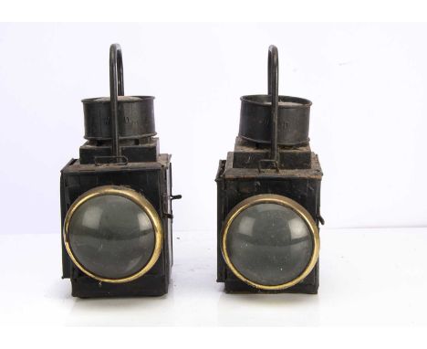 A Pair of War Department Railway Head Lamps, both of square form with loop handles and rear mounting brackets, each marked WD