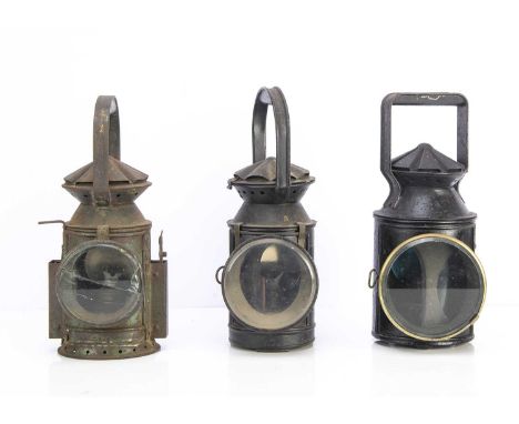 British Military and Two Other Railway Lamps, all of cylindrical form, with loop handles, British Army in worn green paint, m