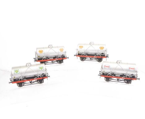 Four Gauge 1 unboxed 14-ton Tank Wagons, believed to be by Aristocraft, finished in silver, two with Shell motifs, one Esso a