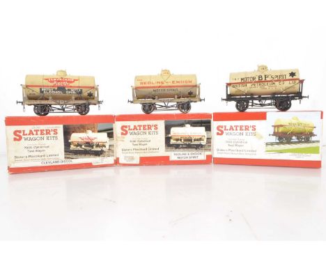 V Three Slater's 0 Gauge kitbuilt buff Fuel Tank wagons (3), Cleveland Discol, BP Motor Spirit and Redline and Ensign, all bu