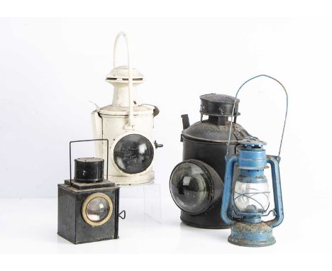 Three Railway Lamps and A Hurricane Lamp,  cylindrical, black painted, minus loop handle, undamaged large front lenses and sm