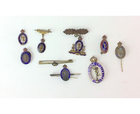 An assortment of nine WW2 Royal Corps of Signals gilt & enamel sweetheart brooches and lapel badges