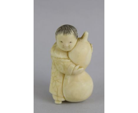 Ivory Netsuke in the shape of Boy and a large fruit 4.5cm tall