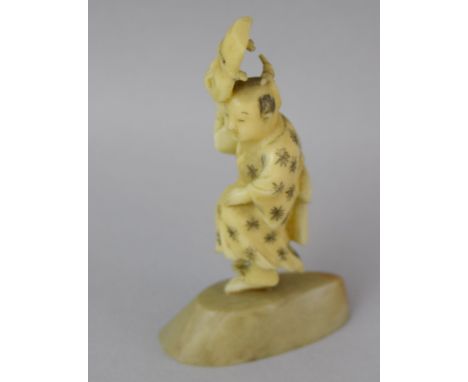 Ivory Netsuke in the shape of Man with a mask 6.5cm tall