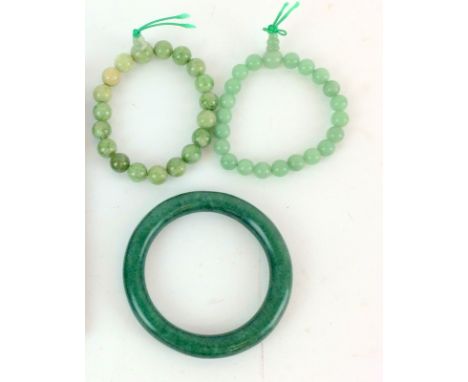 Jade bangle and a pair of jade bracelets