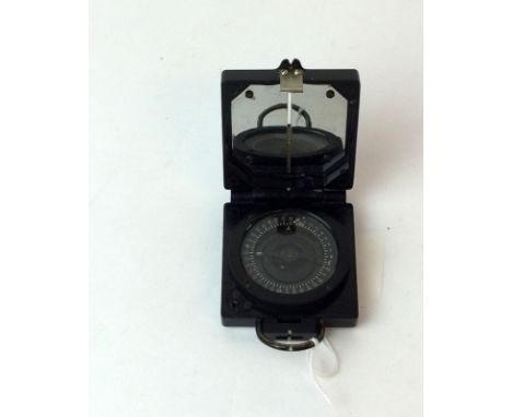A military marked Mark 1 Magnetic Marching Compass made by T.G.Co .Ltd. Serial number B12478