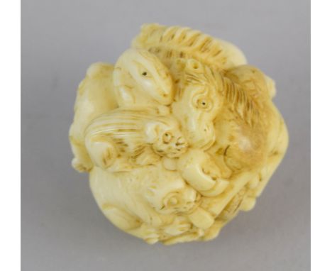 Ivory Netsuke in the shape of a large round group of animals signed