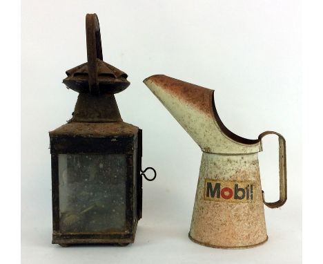 Railway lantern and a Mobil Oil jug
