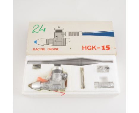 HGK 15 speed glow engine with tuned pipe, New in a box.