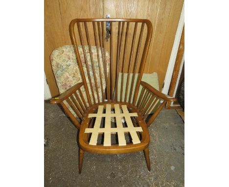 AN ERCOL COTTAGE SUITE ARMCHAIR