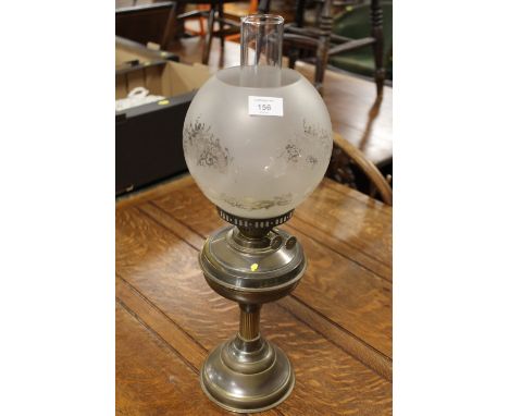 A VINTAGE OIL LAMP WITH ETCHED GLASS SHADE
