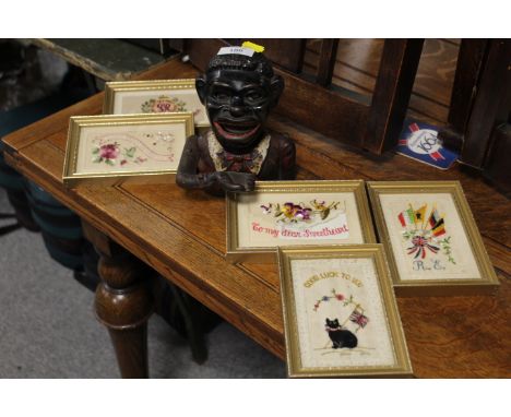 A VINTAGE HAPPY JOE MONEY BANK TOGETHER WITH FOUR FRAMED  SILKS
