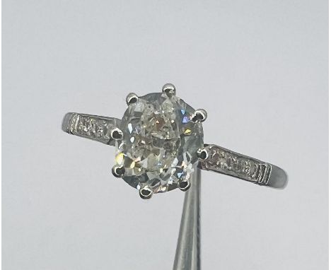 An early 20th century oval cushion cut diamond solitaire ring with an estimated 1.00ct central stone. The diamond has been gr